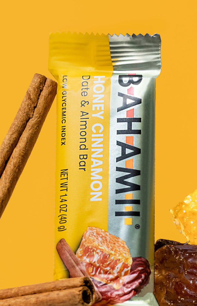 Bahami honey cinnamon date almond bar with cinnamon sticks and honeycomb